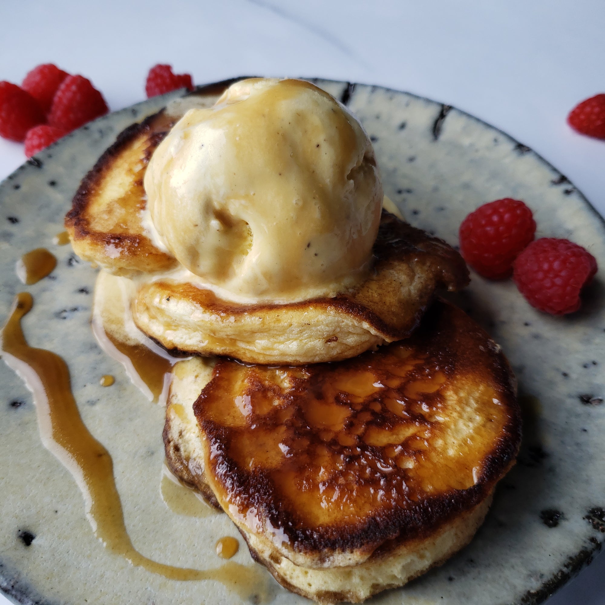 American-style fluffy pancakes with ice-cream and a warm salted butterscotch sauce.