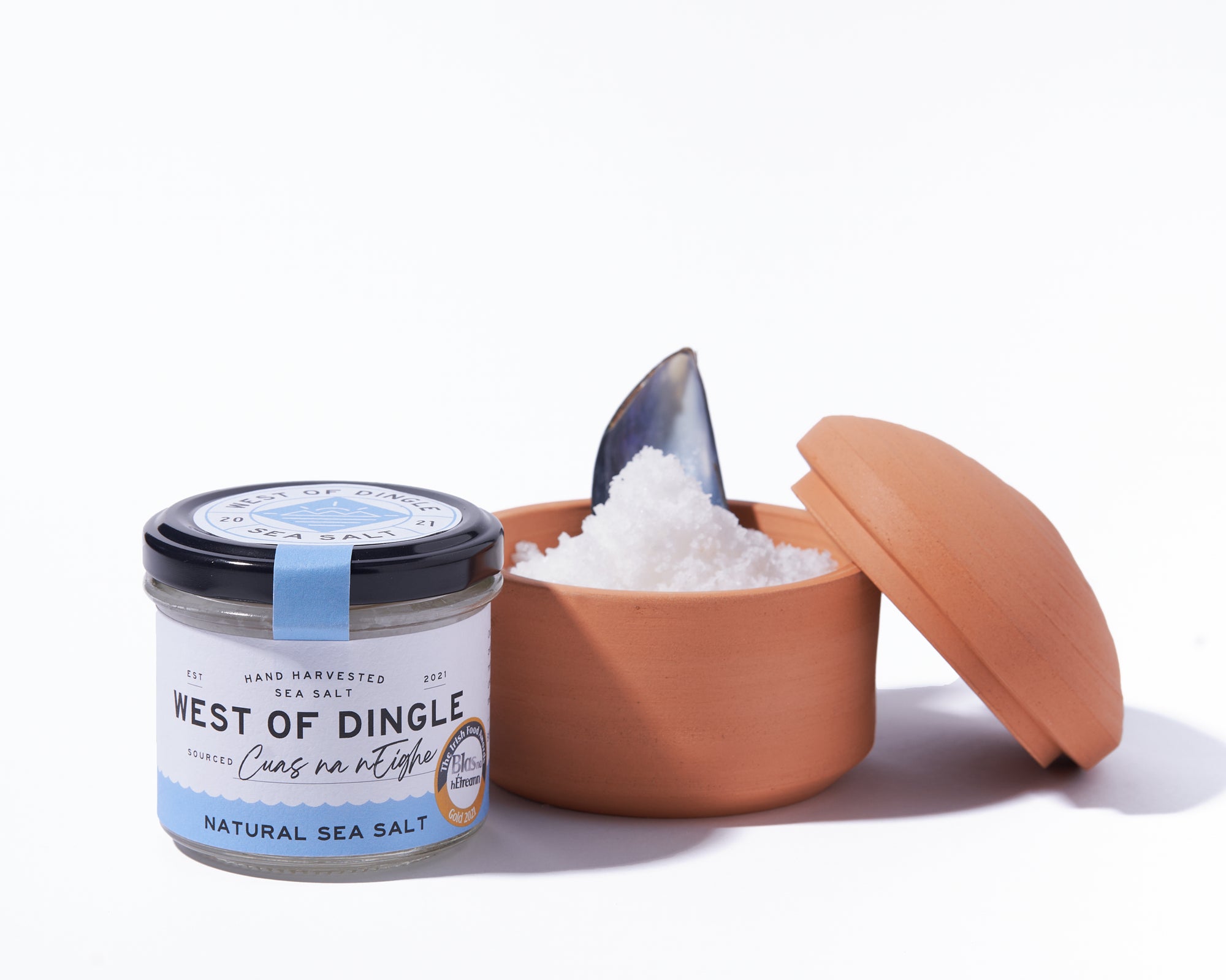 West of Dingle natural sea salt container with a scoop on a white background